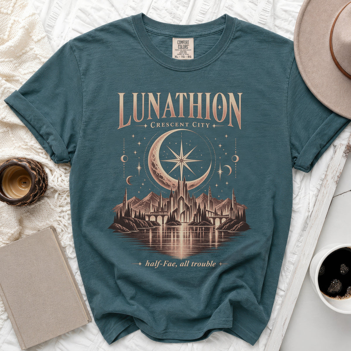 Teal t-shirt with "Lunathion Crescent City" and mystical city scene graphic.