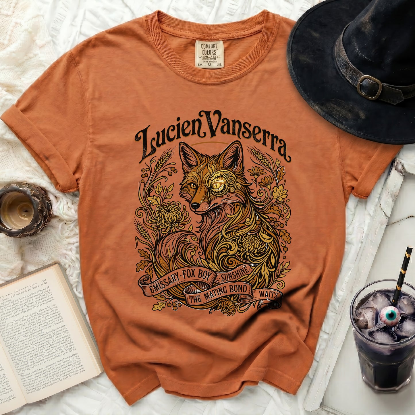 Orange t-shirt with a vintage-style fox illustration and text.