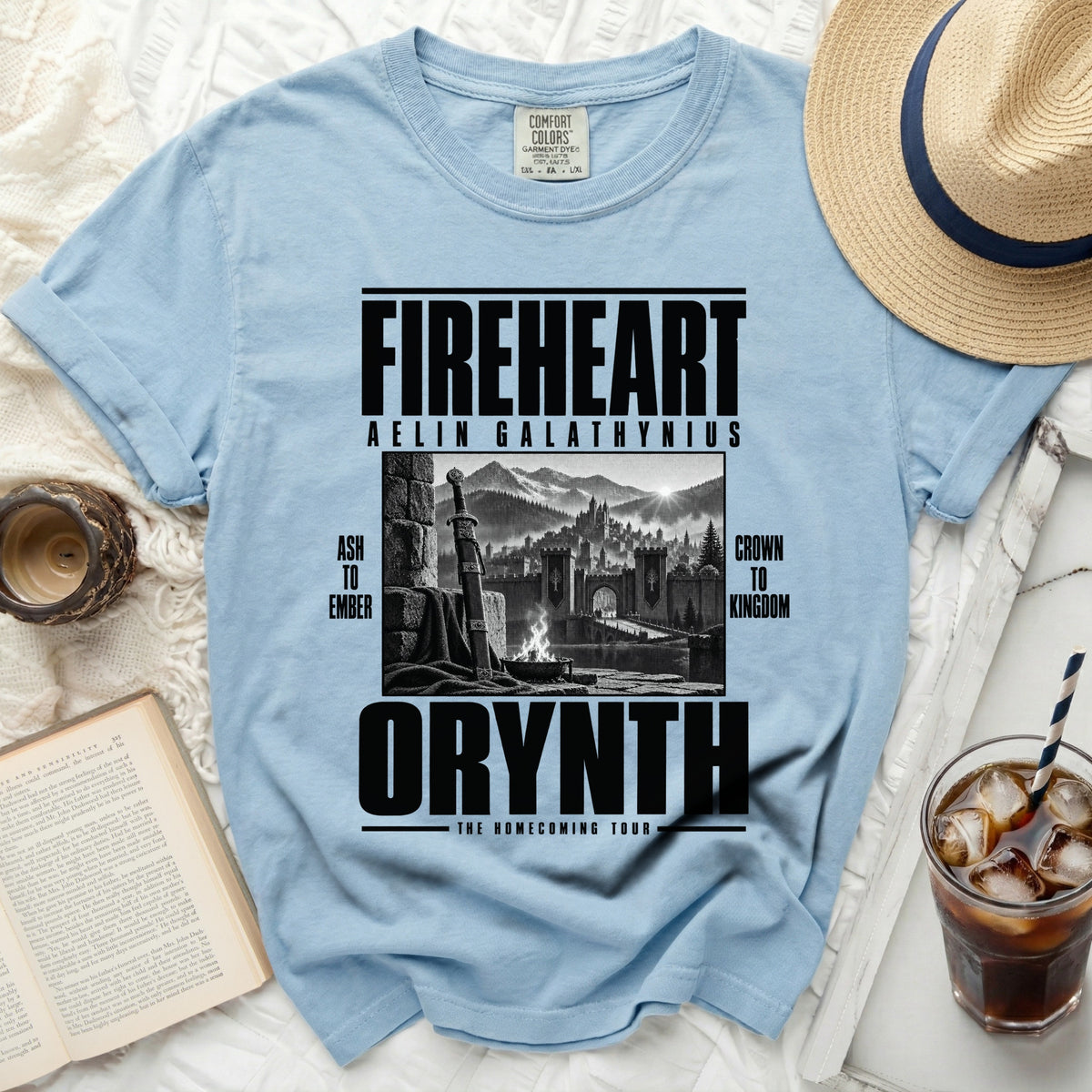 Light blue t-shirt with "FIREHEART AELIN GALATHYNIUS" and a castle scene.