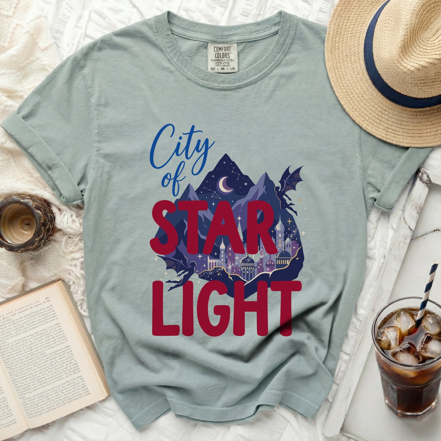 The City of Star Light graphic tee with mountains and dragons.