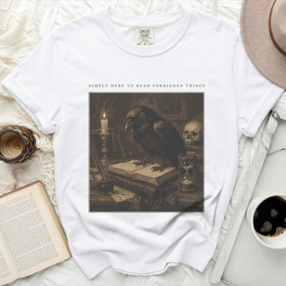 White t-shirt with "Simply Here to Read Forbidden Things" and crow illustration.