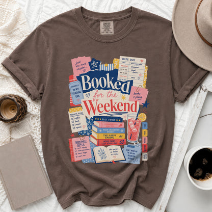 Brown t-shirt with "Booked for the Weekend" graphic and reading-themed elements.