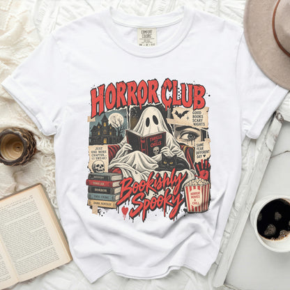 White t-shirt with "Horror Club Bookishly Spooky" graphic featuring a ghost reading.