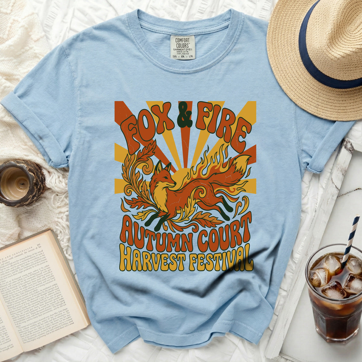 Light blue t-shirt with "Fox & Fire Autumn Court Harvest Festival" graphic.
