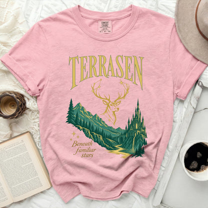 Pink t-shirt with "TERRASEN" and "Beneath familiar stars" text and graphic.