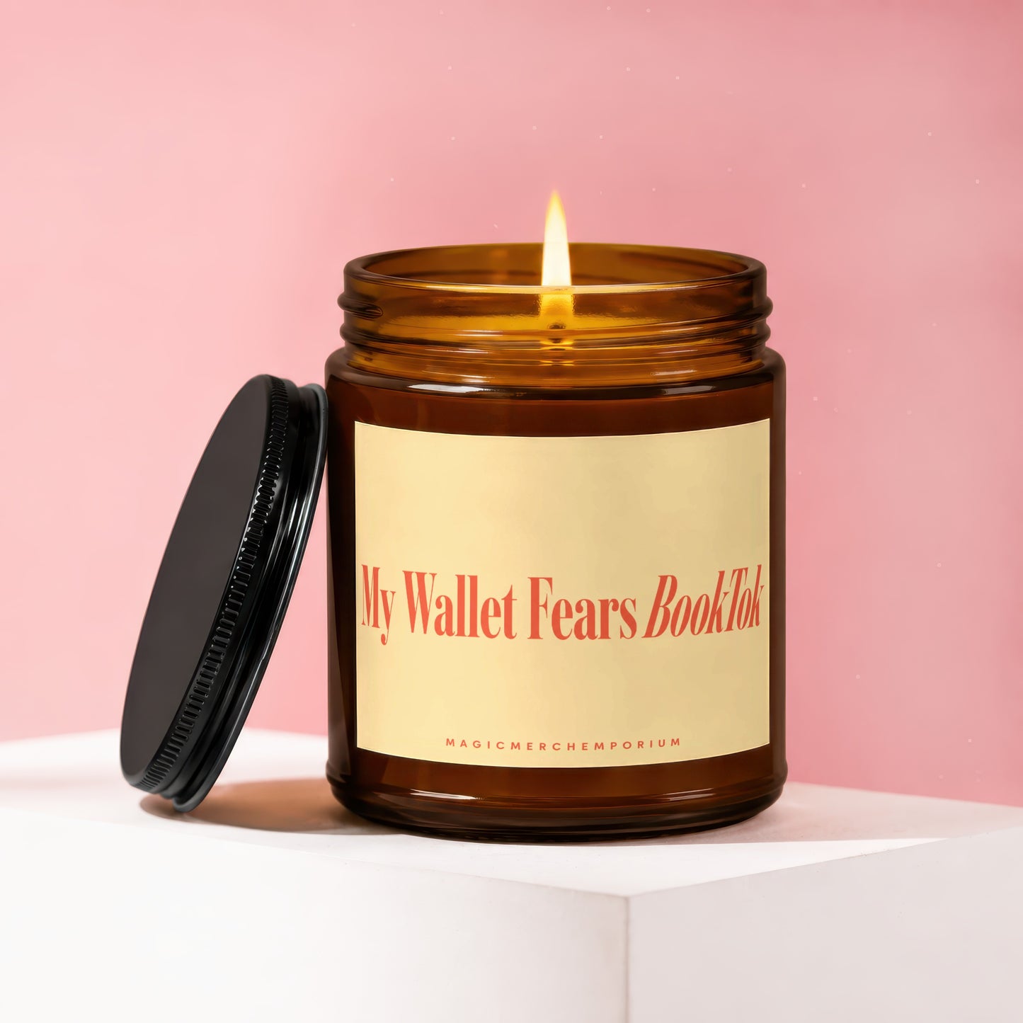 Amber jar candle with lit wick and lid off, labeled "My Wallet Fears BookTok."