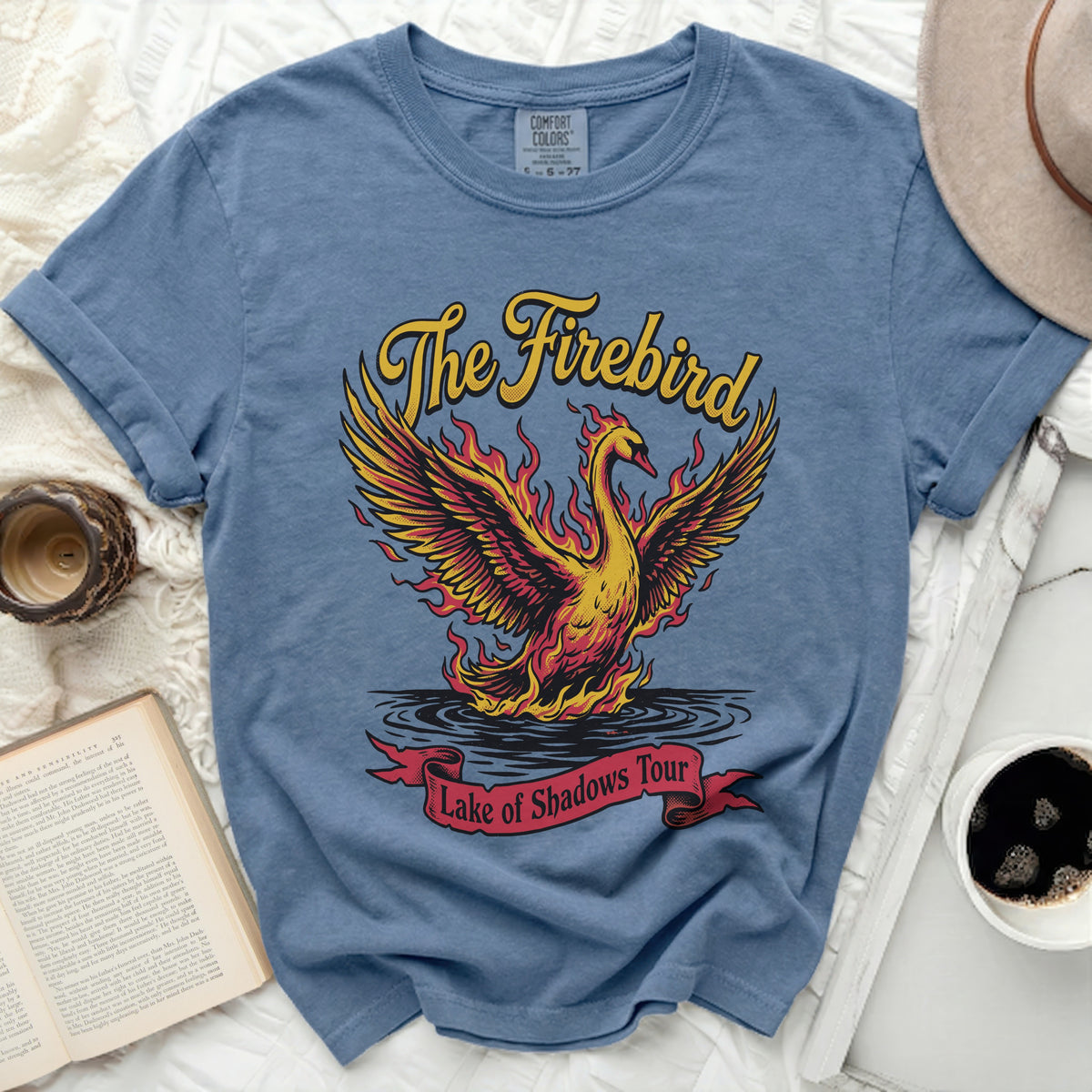 Blue t-shirt with "The Firebird Lake of Shadows Tour" graphic.