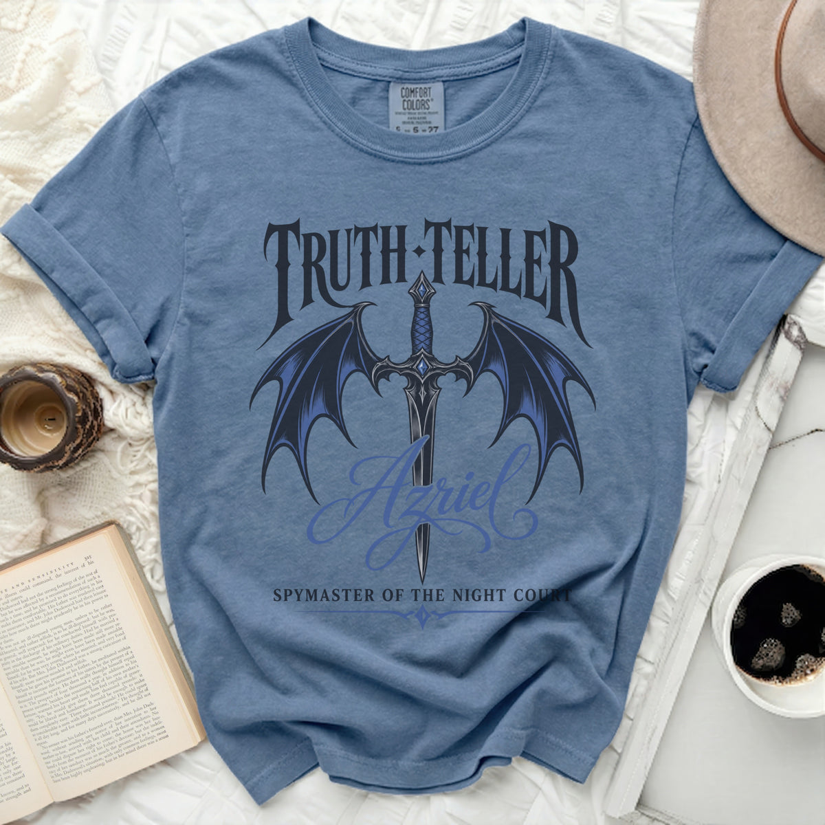 Blue t-shirt with "Truth-Teller Azriel Spymaster of the Night Court" text and sword graphic.
