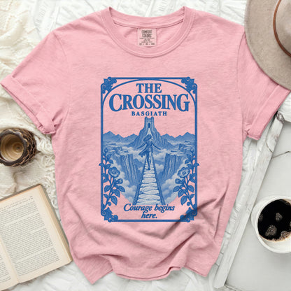 Pink t-shirt with blue graphic of "The Crossing Basgiath" and "Courage begins here."