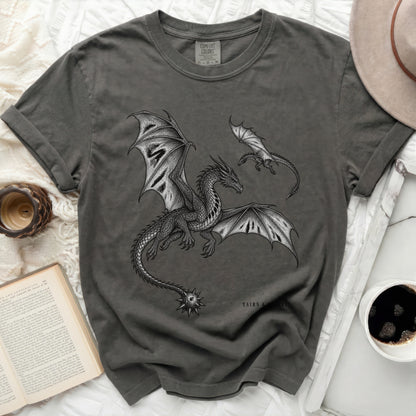 Dark grey t-shirt with a detailed dragon illustration and "TAIRN & SCAEYL" text.