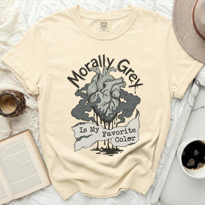 Cream t-shirt with a black ink drawing of a heart, smoke, and the text "Morally Grey Is My Favorite Color."