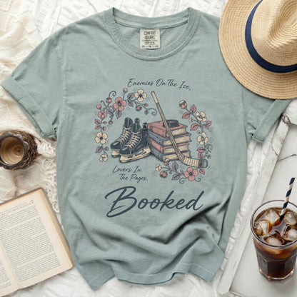 Light blue t-shirt with "Booked" and roller skates design.