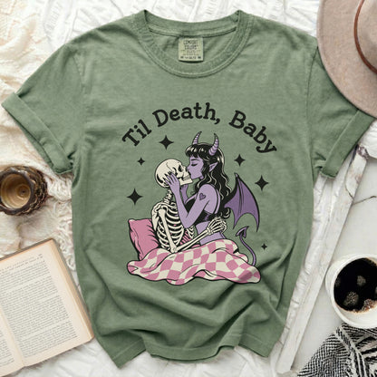 Green t-shirt with devil woman kissing skeleton, "Til Death, Baby" text.