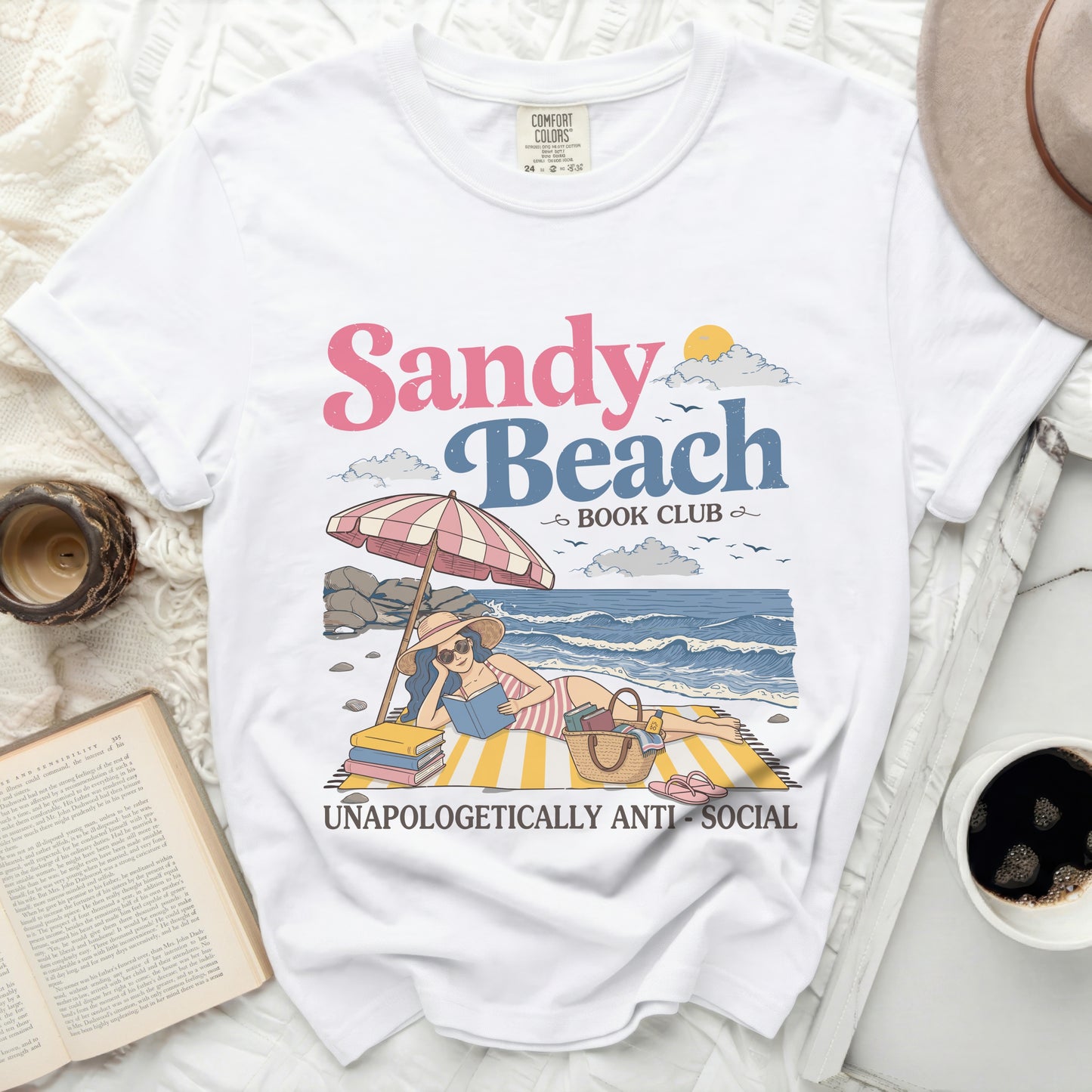 White t-shirt with "Sandy Beach Book Club" graphic and "Unapologetically Anti-Social."
