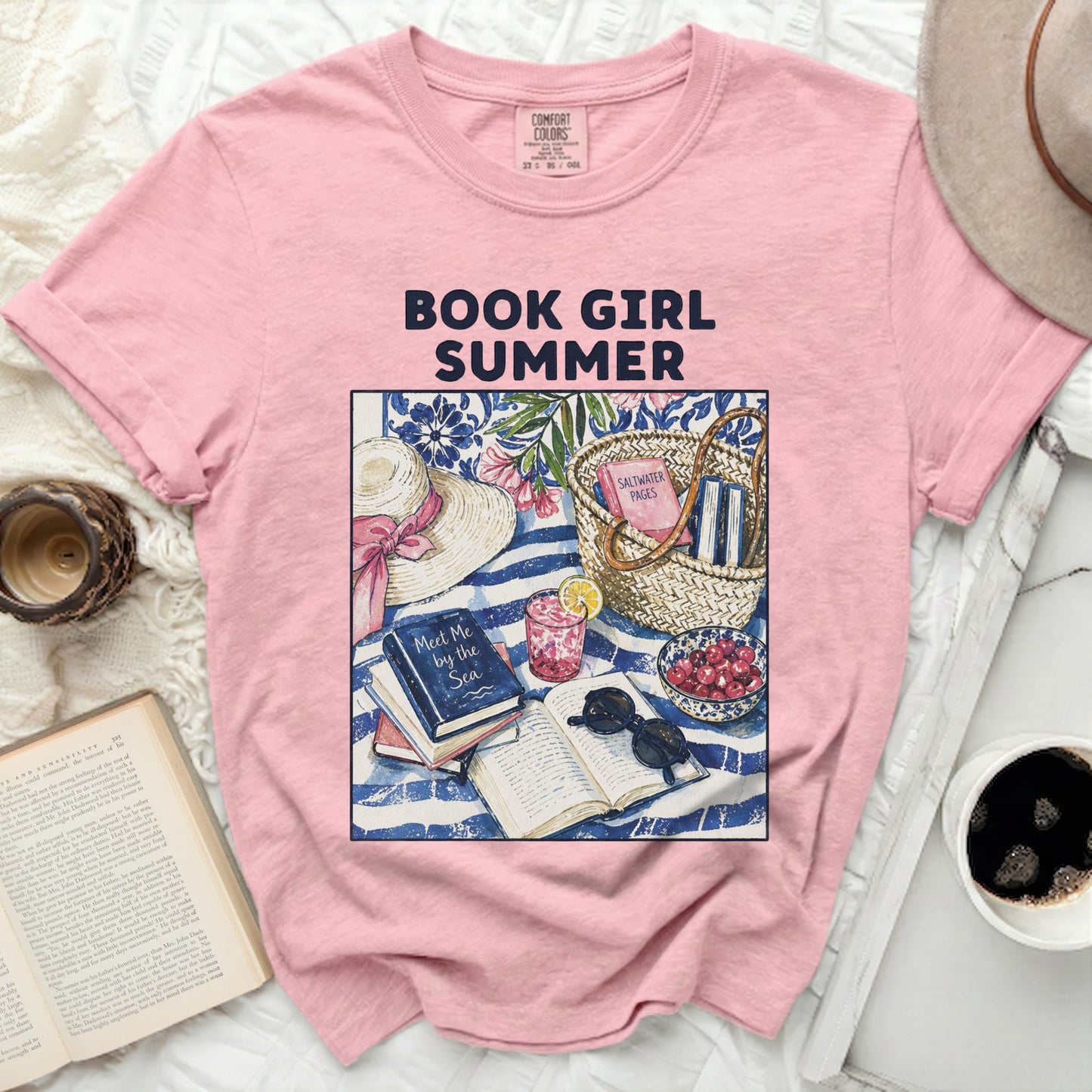 Pink t-shirt with "BOOK GIRL SUMMER" text and beach scene graphic.