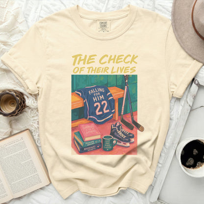 Comfort Colors cream t-shirt with "The Check of Their Lives" and hockey graphics.