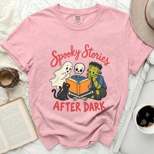 Pink Comfort Colors shirt with spooky characters reading a book.