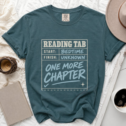 Teal t-shirt with "Reading Tab: Start Bedtime, Finish Unknown, One More Chapter" graphic.
