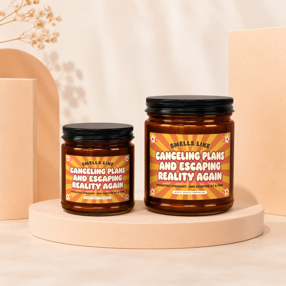 Two amber glass candles with "Smells Like Canceling Plans and Escaping Reality Again" text.