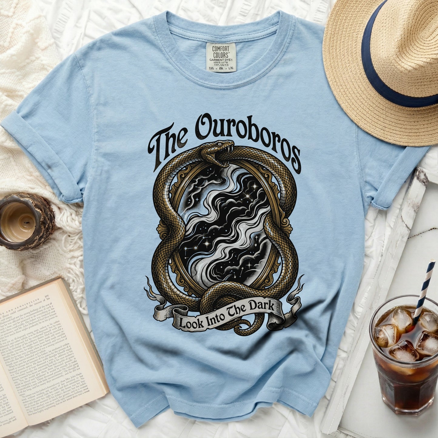 Light blue t-shirt with Ouroboros snake and "The Ouroboros Look Into The Dark" text.