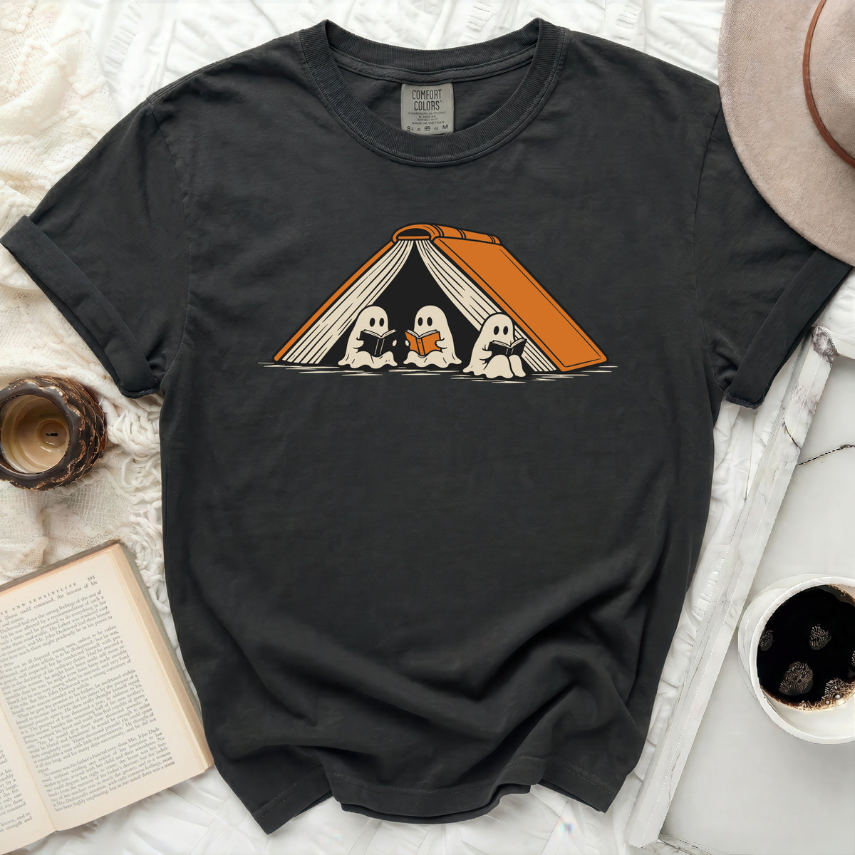 Dark gray t-shirt with three ghosts reading under an open book graphic.