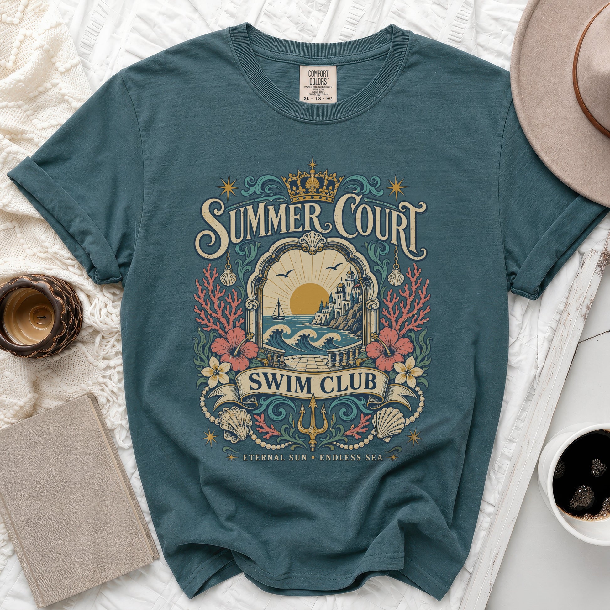 Teal t-shirt with "Summer Court Swim Club" graphic and coastal design.