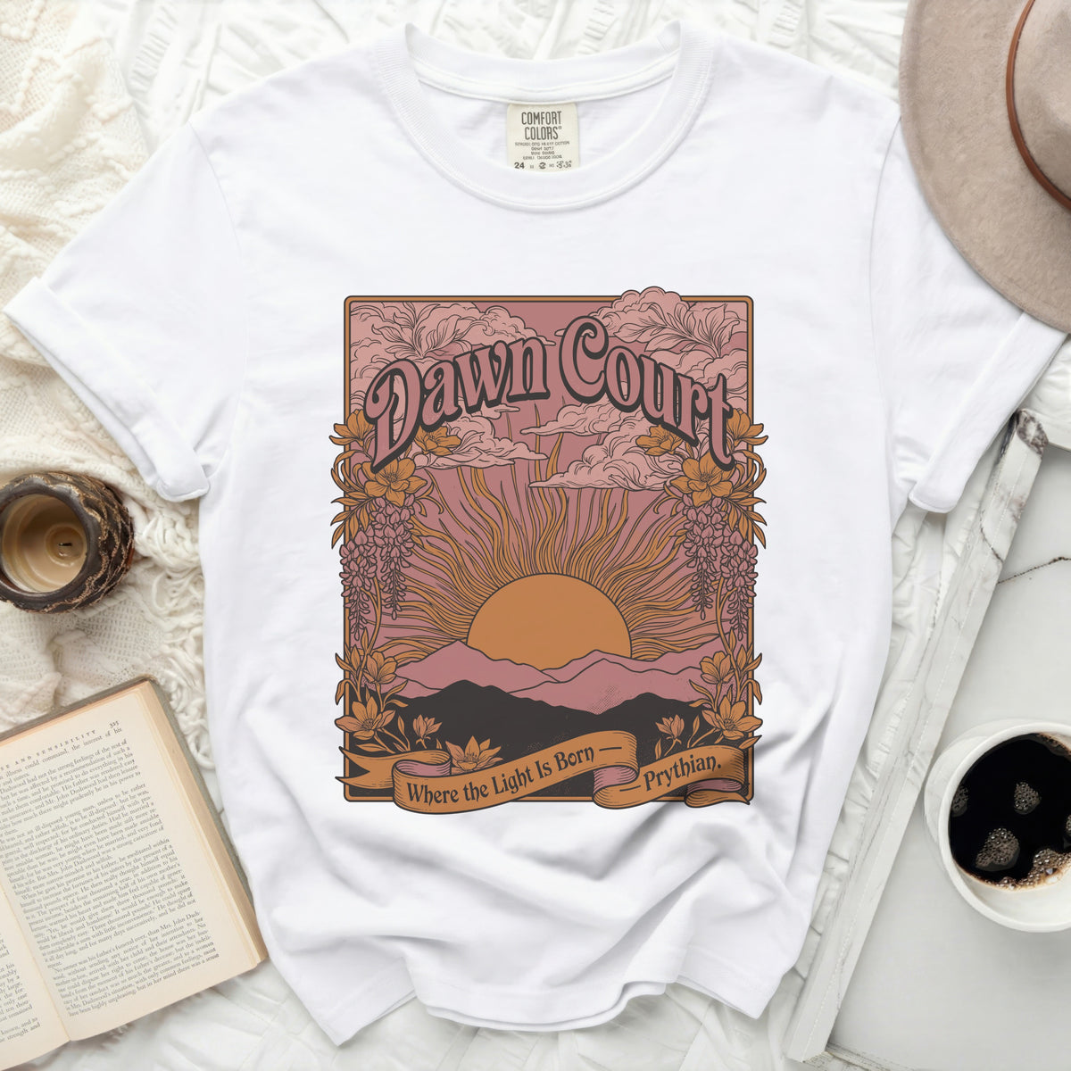White t-shirt with "Dawn Court Where the Light Is Born Prythian" graphic.