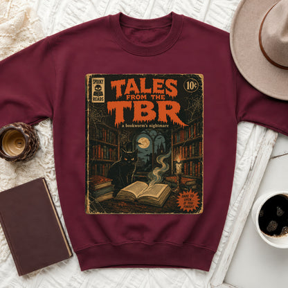 Burgundy crewneck sweatshirt featuring "Tales From The TBR" comic book art with a black cat.