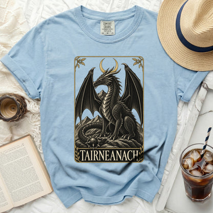 Light blue t-shirt with a black dragon design and "TAIRNEANACH" text.