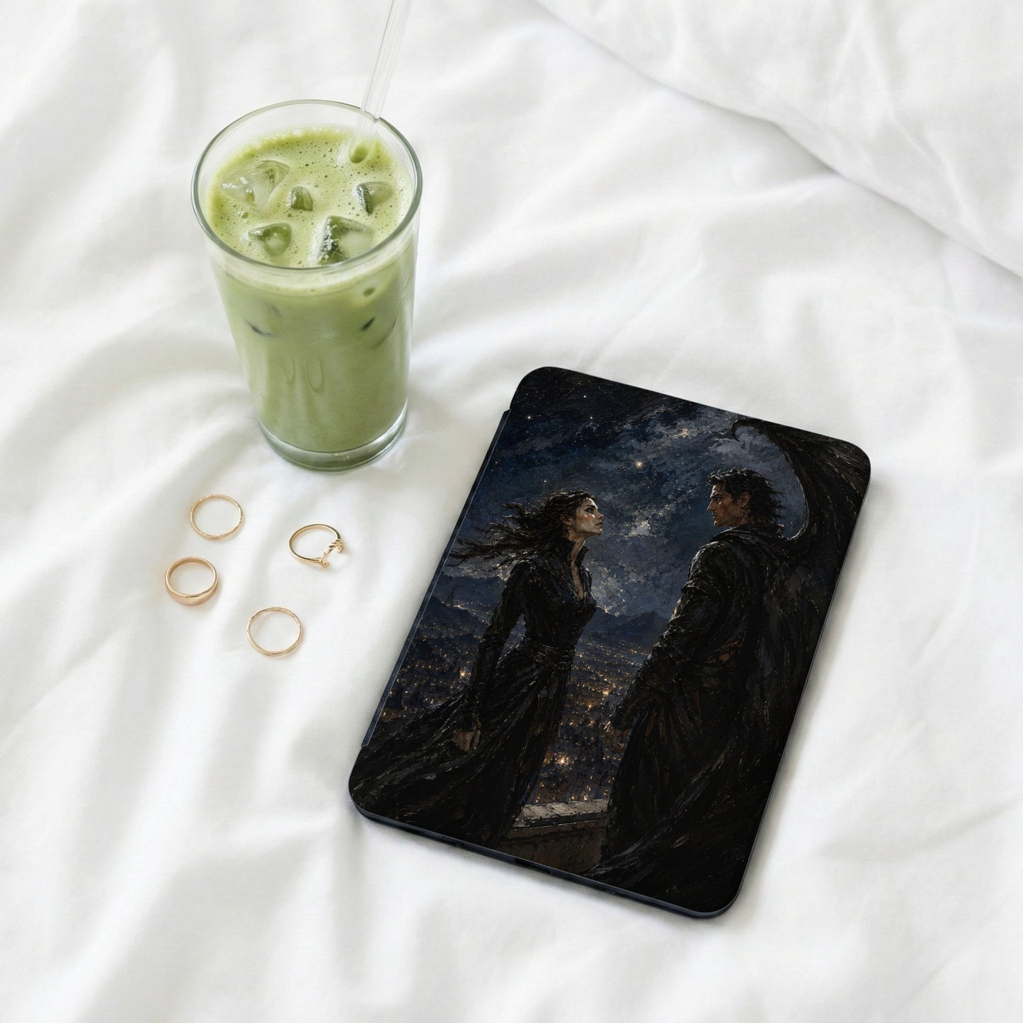 Tablet case with fantasy art of winged man and woman over city at night.