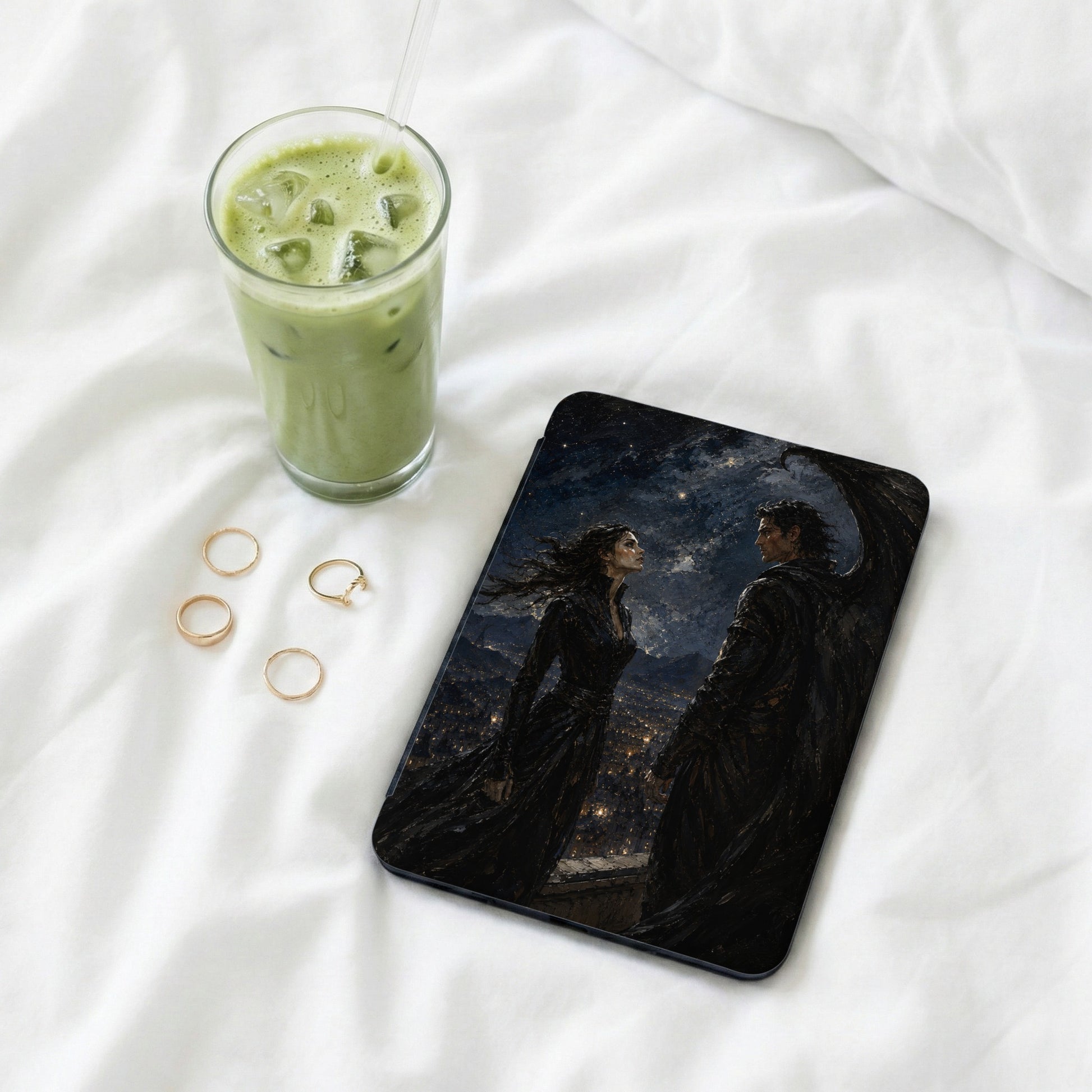 Tablet case with fantasy art of winged man and woman over city at night.