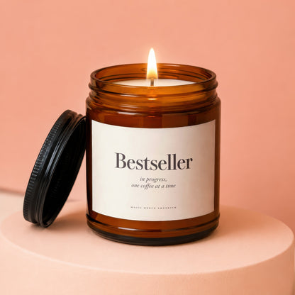 Amber jar candle with lit flame, black lid nearby, and text.
