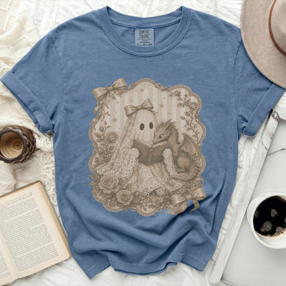 Ghost and dragon reading a book on a blue t-shirt.