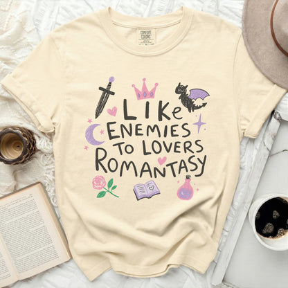 Cream t-shirt with "Like Enemies to Lovers Romantasy" text and fantasy icons.