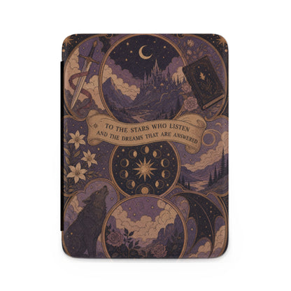 Book cover with ornate celestial, wolf, and castle design. Text says "To the stars who listen and the dreams that are answered."