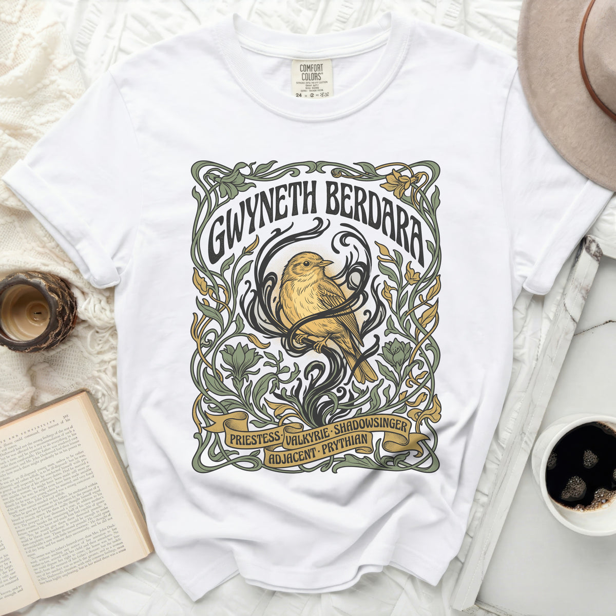 White t-shirt with art nouveau design featuring a bird and text.