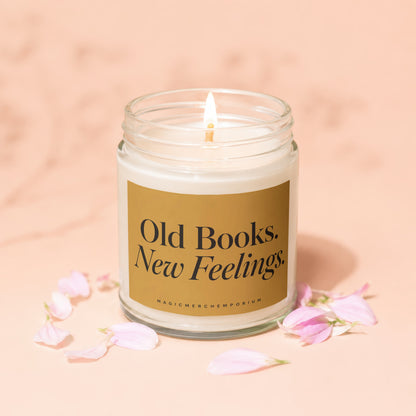 Lit candle in glass jar with gold label reading "Old Books. New Feelings."
