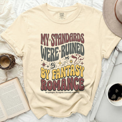Cream t-shirt with "My Standards Were Ruined By Fantasy Romance" text.