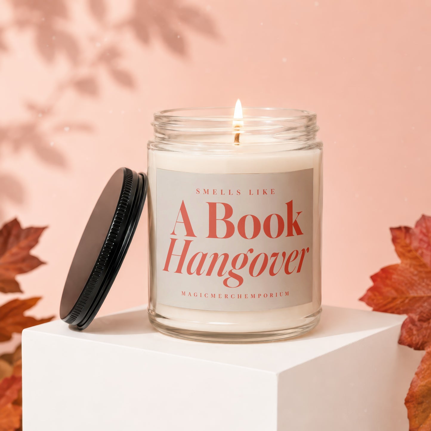 Scented candle with text "Smells Like A Book Hangover" and "Magicmerchemporium"