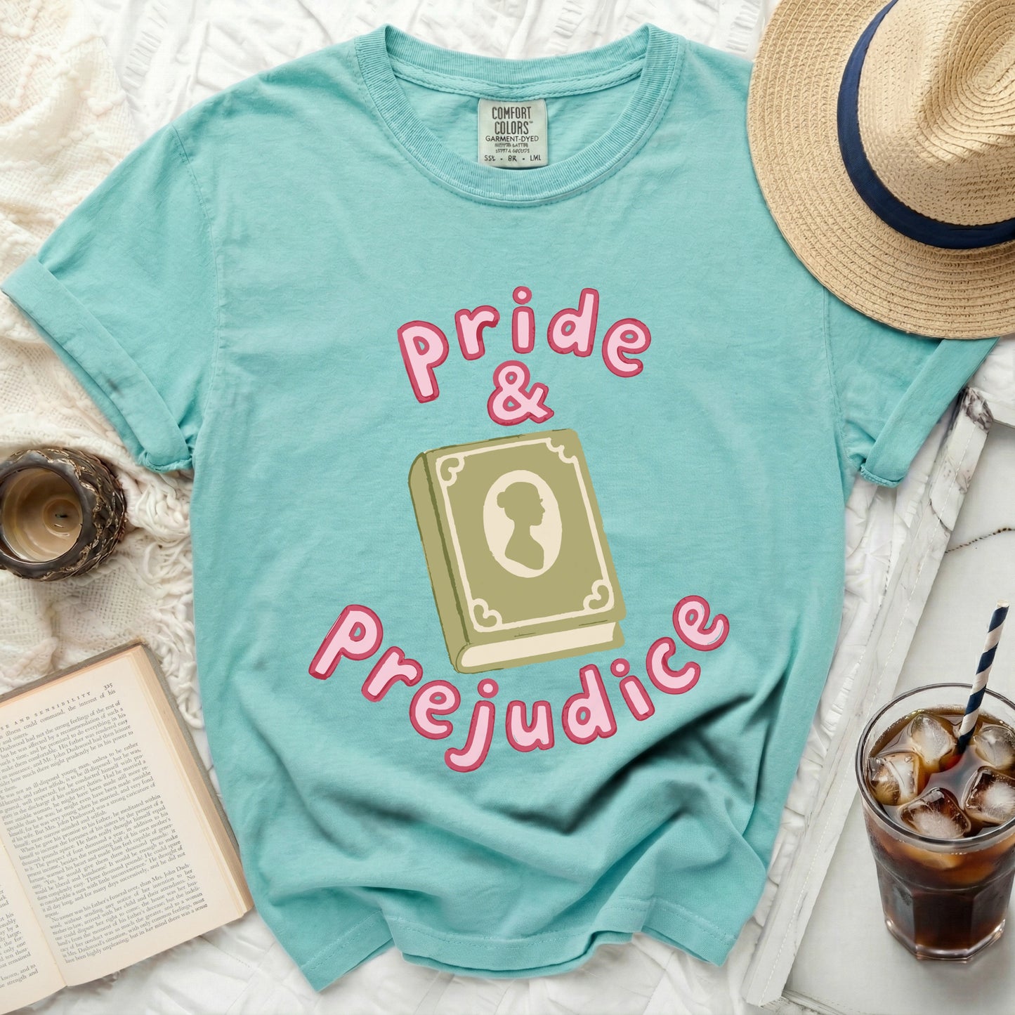 Turquoise t-shirt with "Pride & Prejudice" and open book graphic.