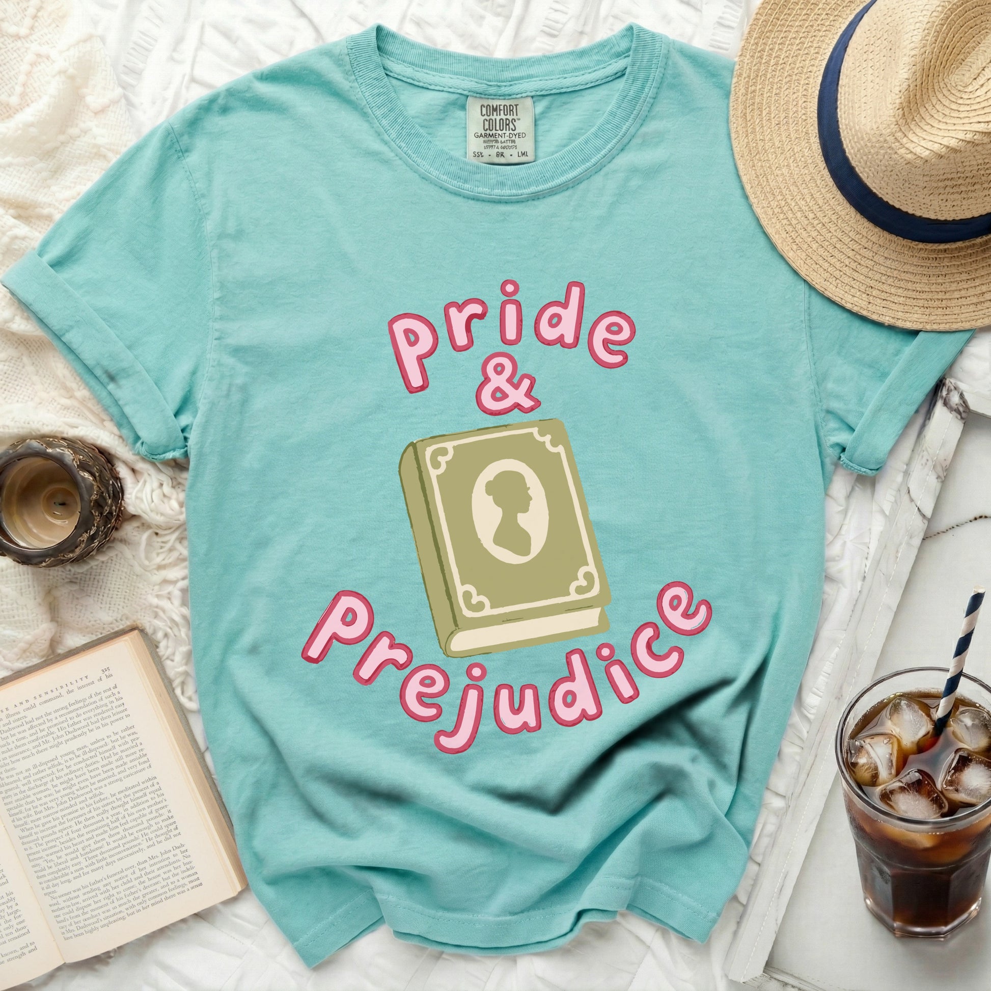 Turquoise t-shirt with "Pride & Prejudice" and open book graphic.