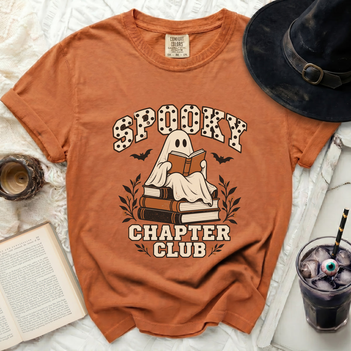 Orange t-shirt with ghost reading books and "Spooky Chapter Club" text.