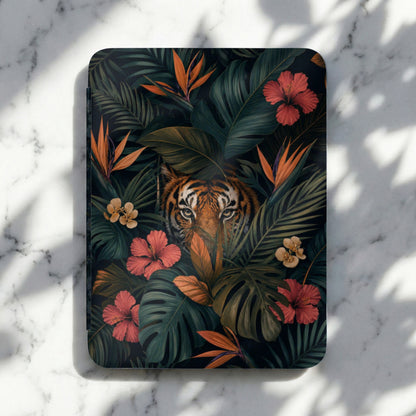 Journal with tiger face and tropical flowers and leaves in a dark jungle setting.
