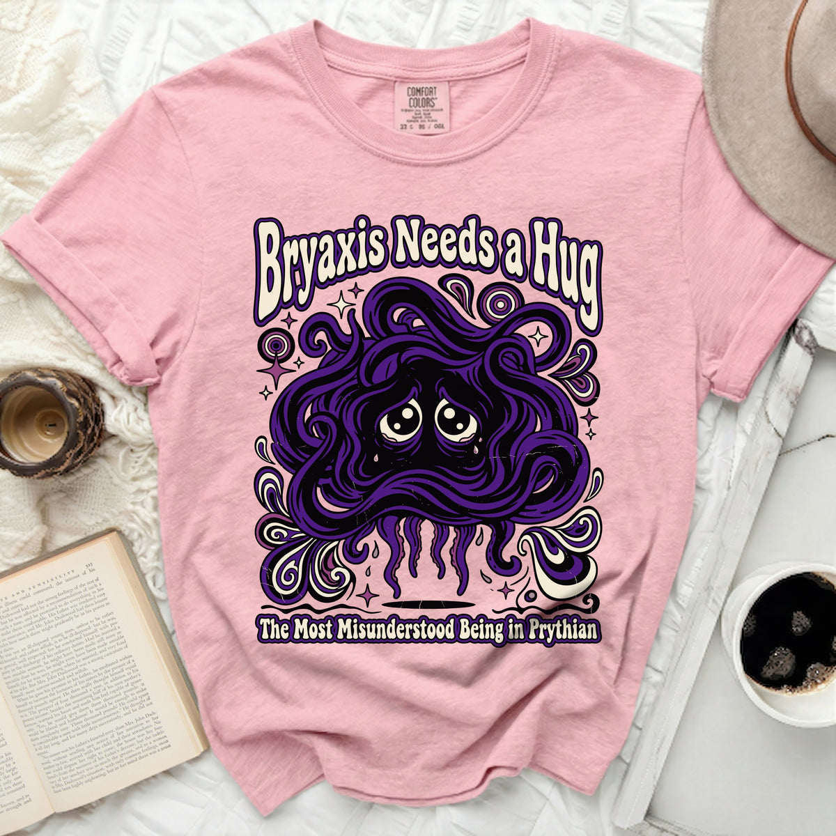 Pink t-shirt with "Bryaxis Needs a Hug" and a sad purple monster.