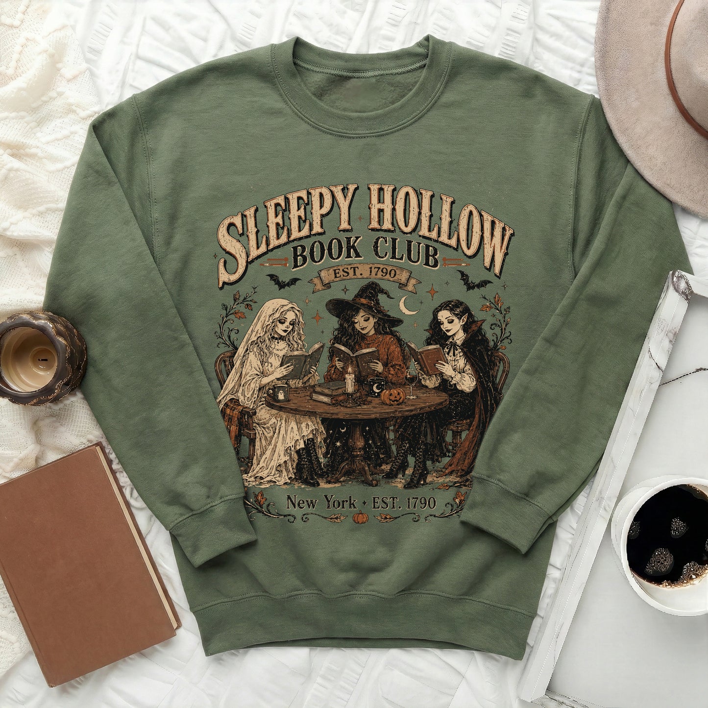 Green sweatshirt with "Sleepy Hollow Book Club Est. 1790" design and three women reading.