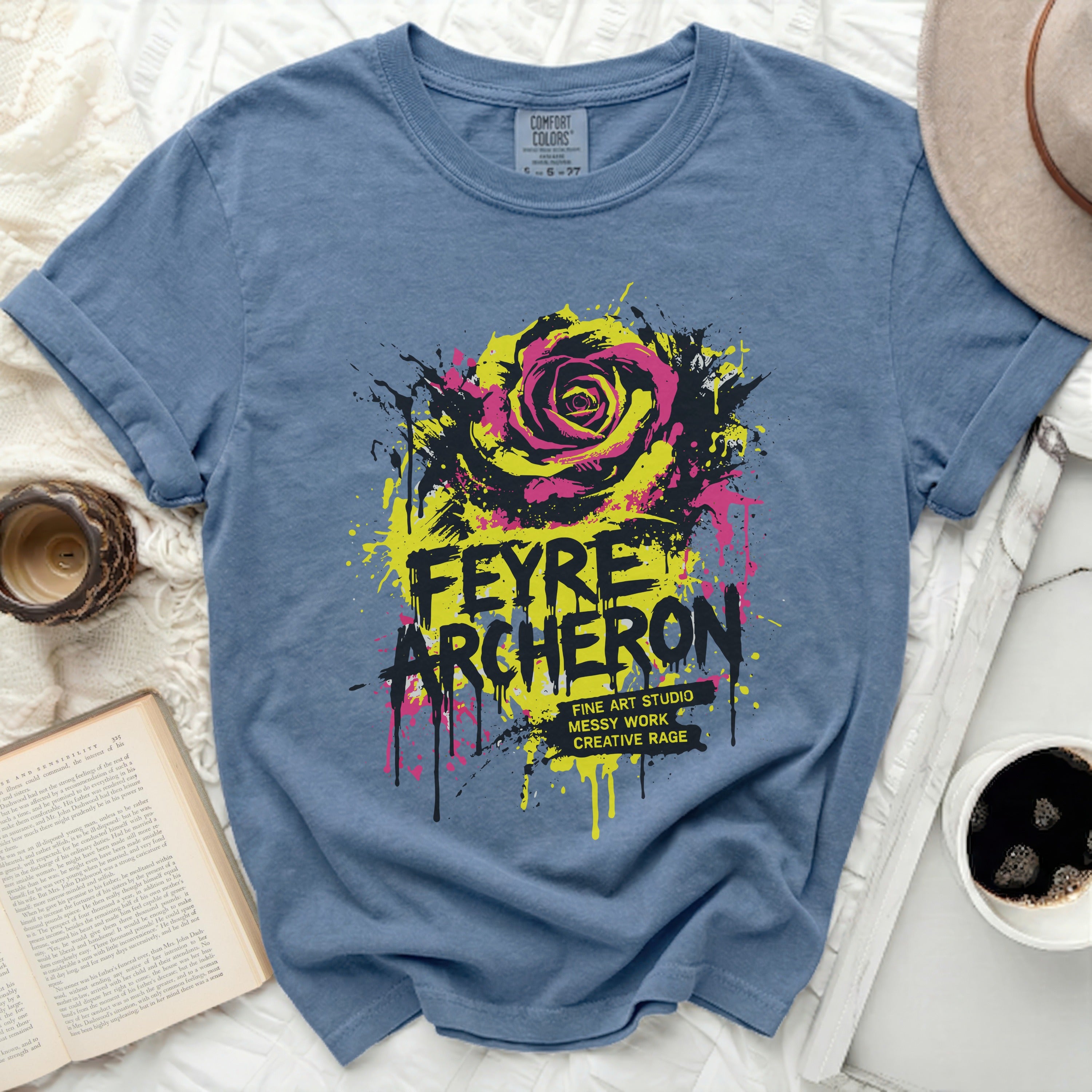 Blue t-shirt with a yellow and pink rose graphic and 