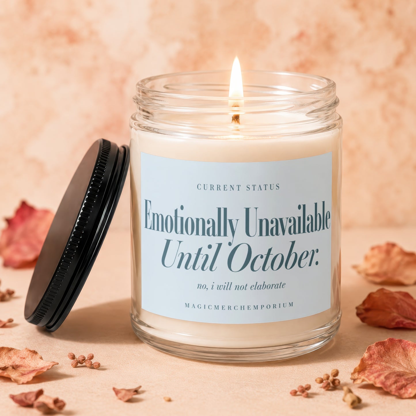 Candle with "Emotionally Unavailable Until October" text and a lit wick.