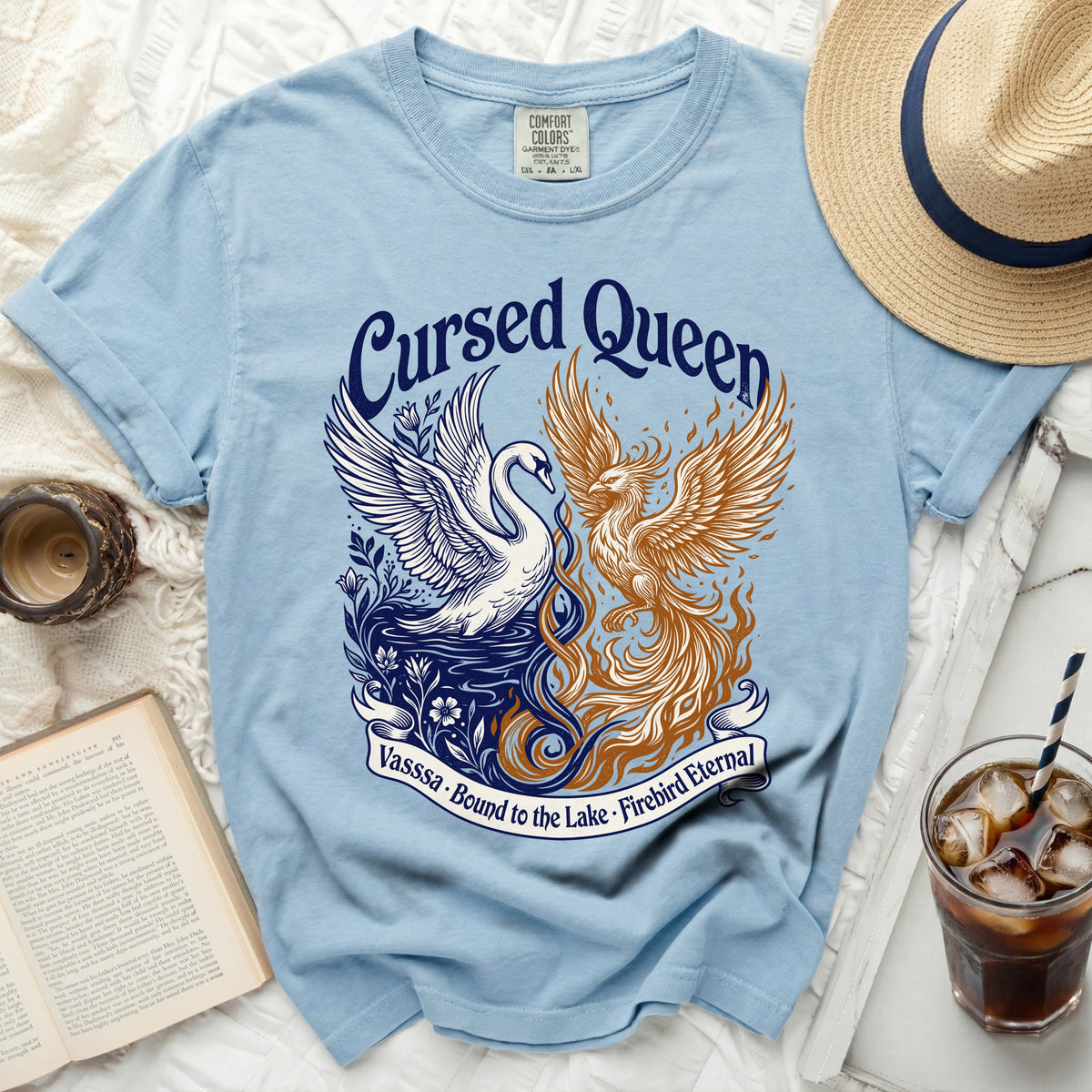 Blue t-shirt with "Cursed Queen" and swan and phoenix graphic.