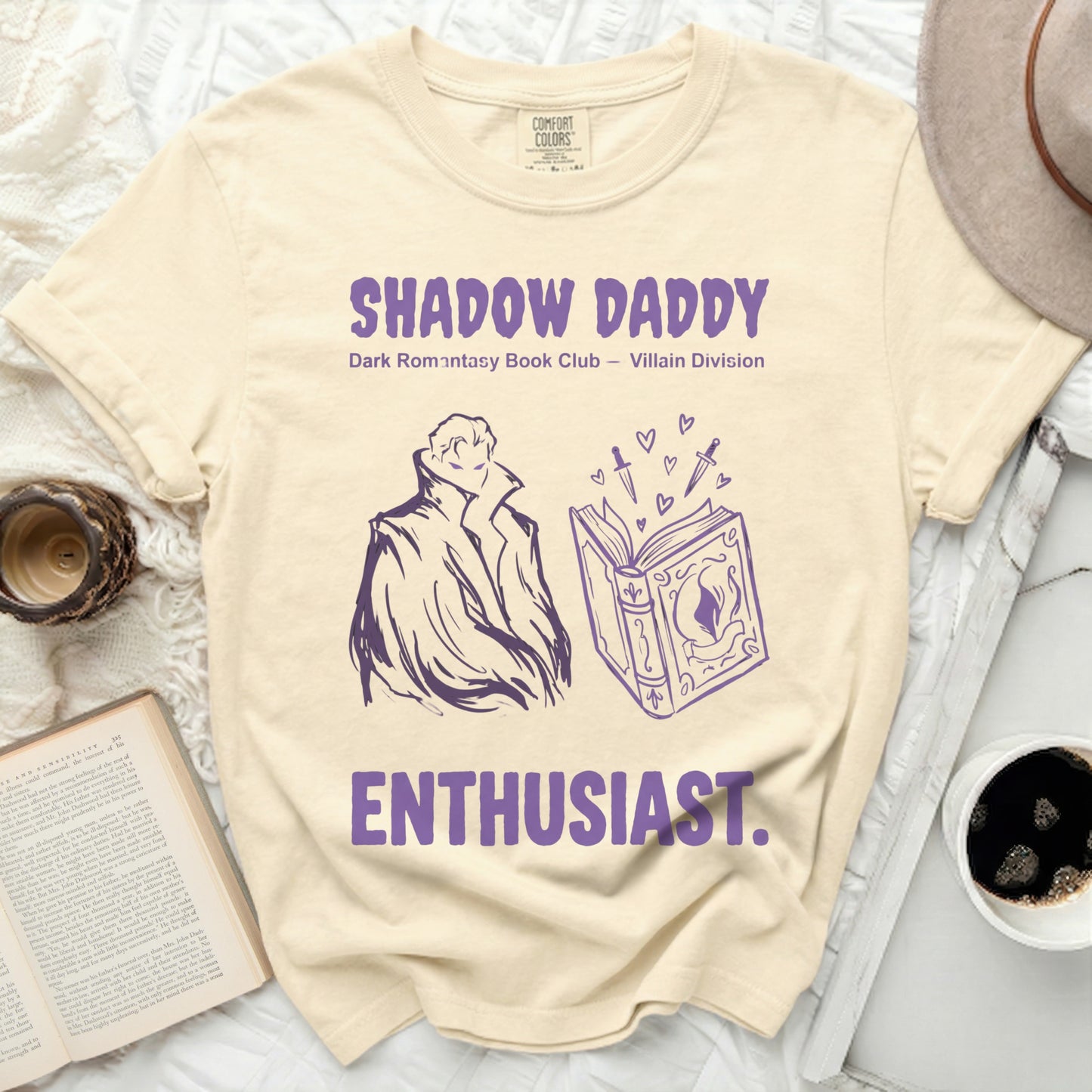 Light yellow t-shirt with dark purple "Shadow Daddy Enthusiast" text and graphic.