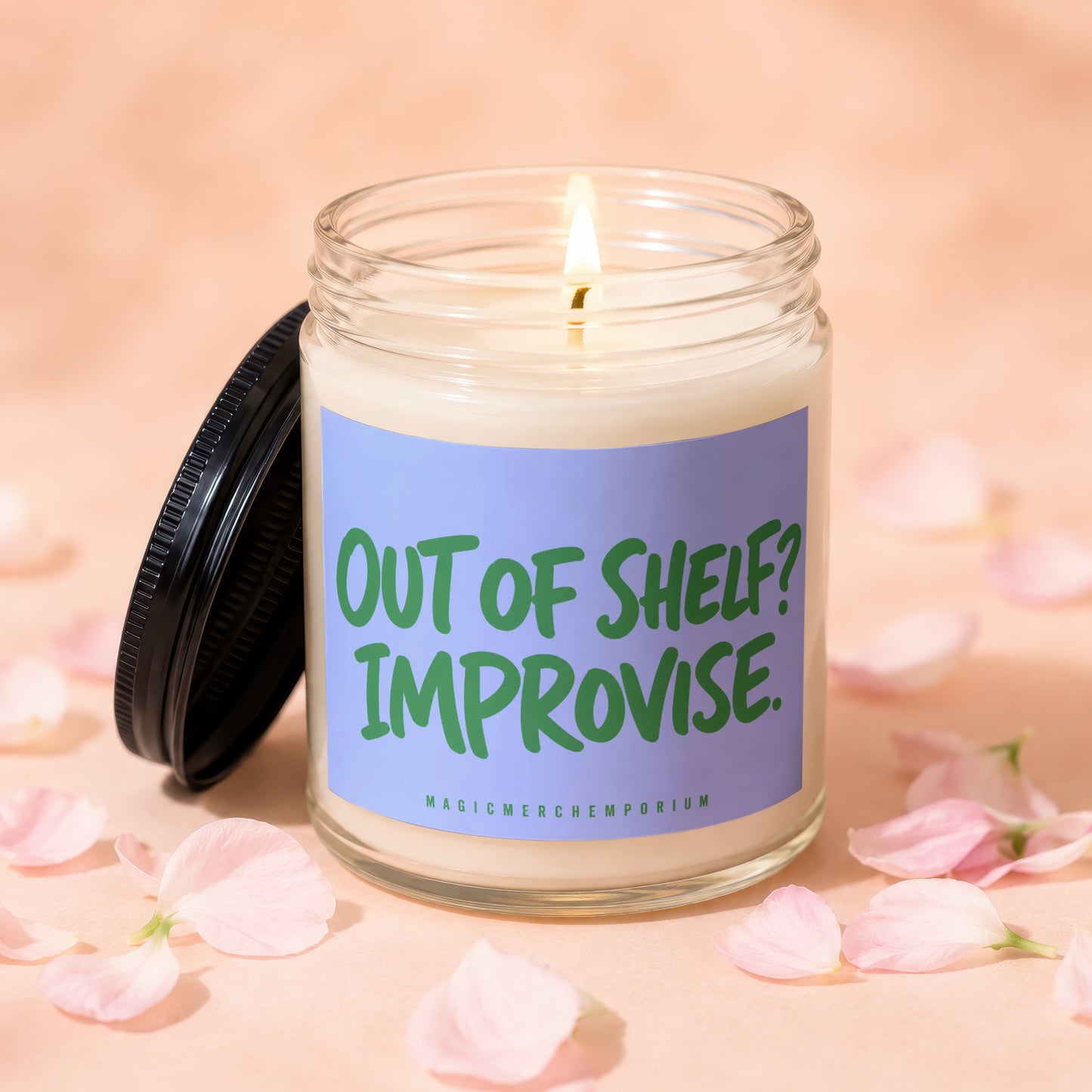 Lit candle in a jar with a lavender label reading "Out of Shelf? Improvise."